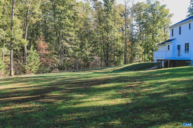 a view of a field with an ocean
