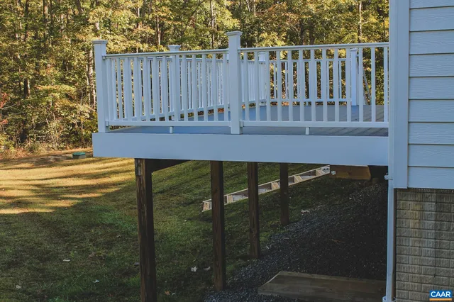 a backyard of a house with lots of trees