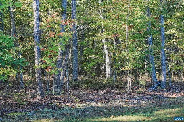 a view of a house with a fence