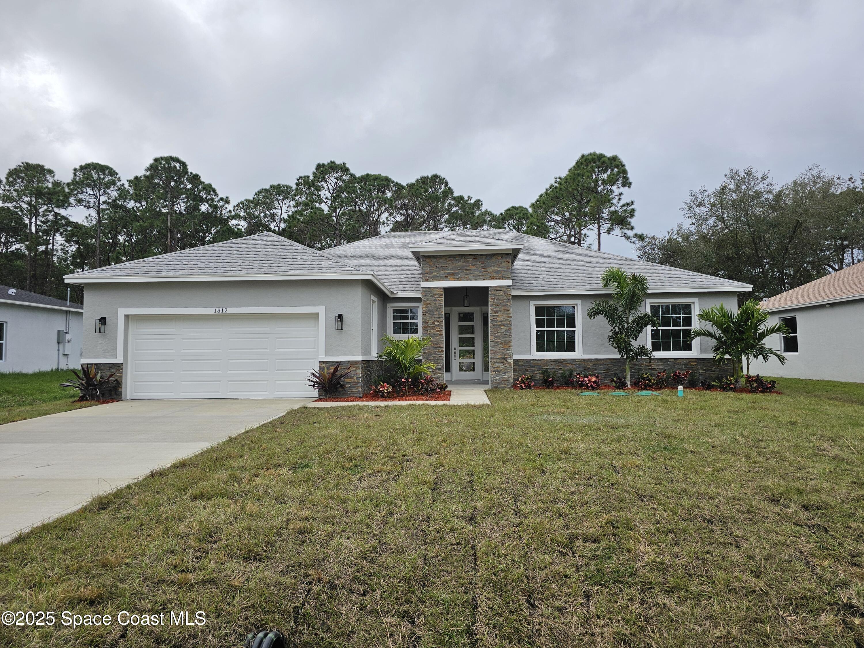 1312 Saxony Road Southwest Palm Bay, FL 32908 - Photo 1 of 52 Front
