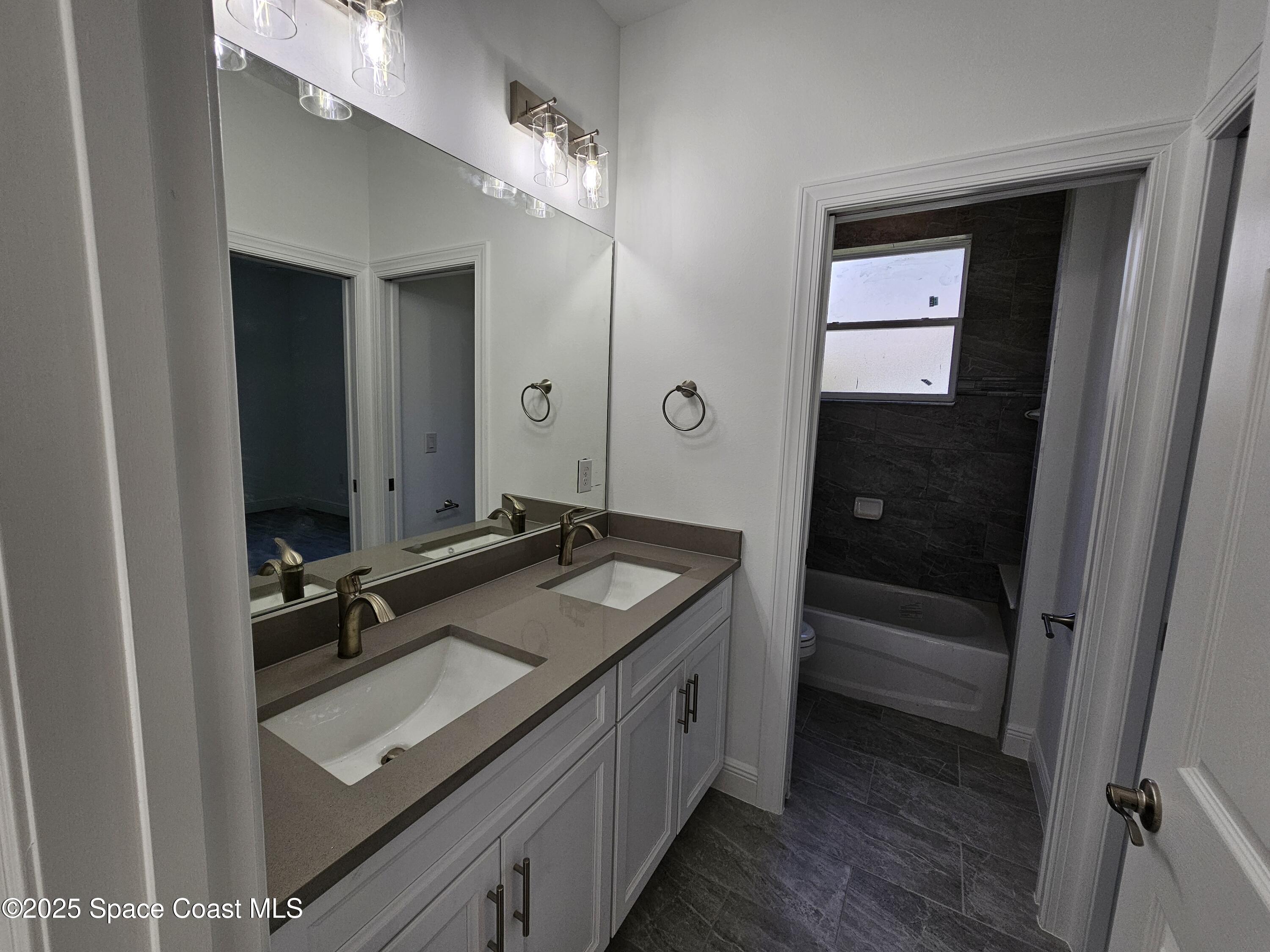1312 Saxony Road Southwest Palm Bay, FL 32908 - Photo 30 of 52 Bathroom 2-1