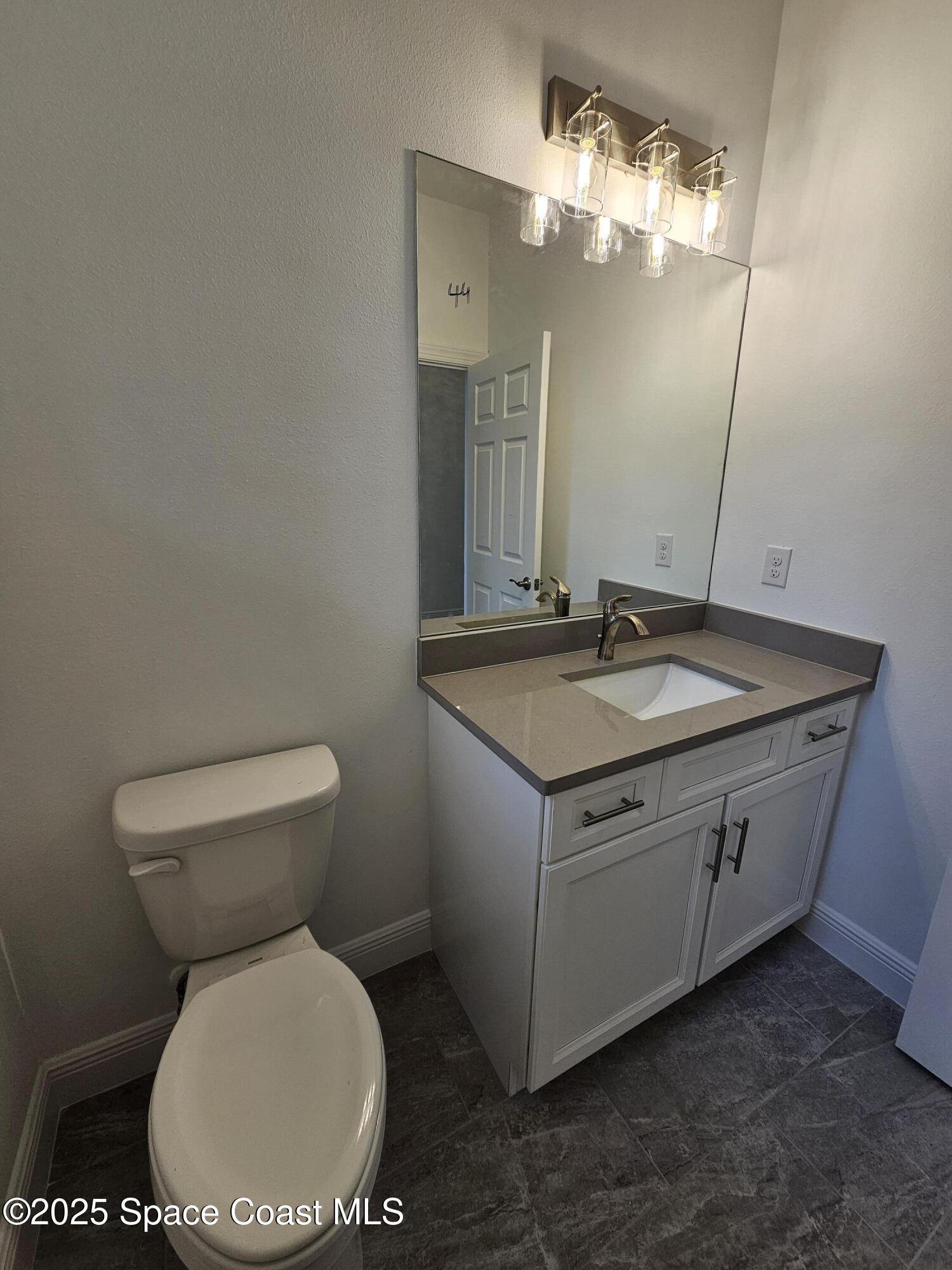 1312 Saxony Road Southwest Palm Bay, FL 32908 - Photo 9 of 52 Half Bath 2