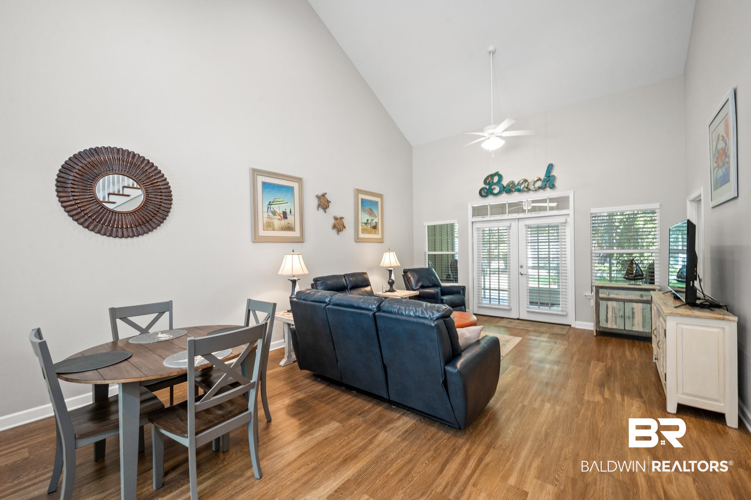 430 West Fort Morgan Road, Unit 1902 Gulf Shores, AL 36542 - Photo 11 of 59 Living room with hardwood / wood-style flooring, french doors, high vaulted ceiling, and ceiling fan