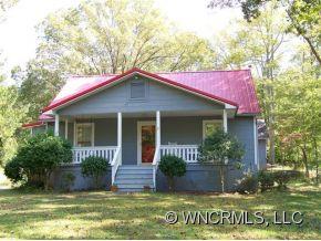 130 Bradshaw Road Tryon, NC 28782 - Photo 1 of 16 front view of a house with a yard