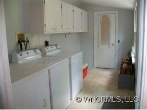 130 Bradshaw Road Tryon, NC 28782 - Photo 11 of 16 a bathroom with a sink and cabinets