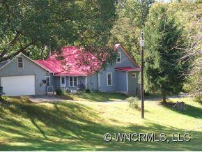 130 Bradshaw Road Tryon, NC 28782 - Photo 15 of 16 a house with swimming pool in front of it