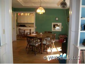 130 Bradshaw Road Tryon, NC 28782 - Photo 6 of 16 a view of a dining room with furniture and chandelier