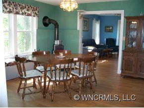 130 Bradshaw Road Tryon, NC 28782 - Photo 7 of 16 a dining room with furniture and wooden floor