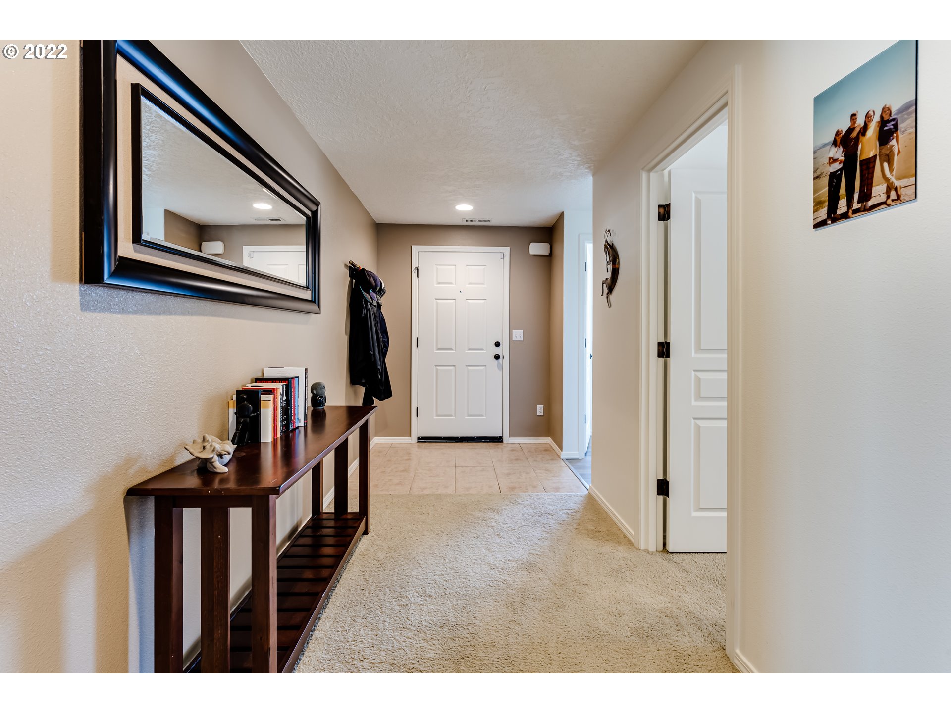 569 South 48th Street Springfield, OR 97478 - Photo 12 of 23 a view of a hallway with wooden floor and stairs