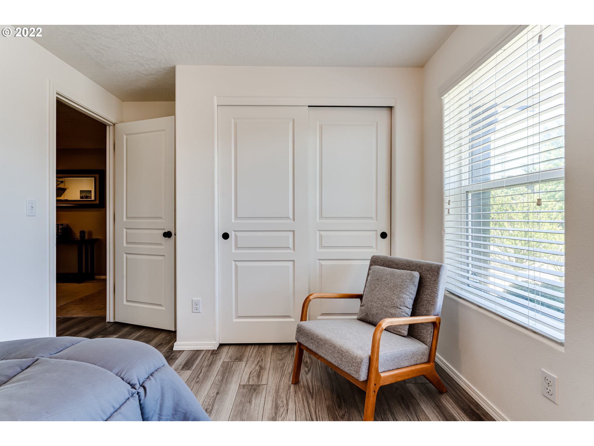 569 South 48th Street Springfield, OR 97478 - Photo 14 of 23 a bedroom with a bed and a chair