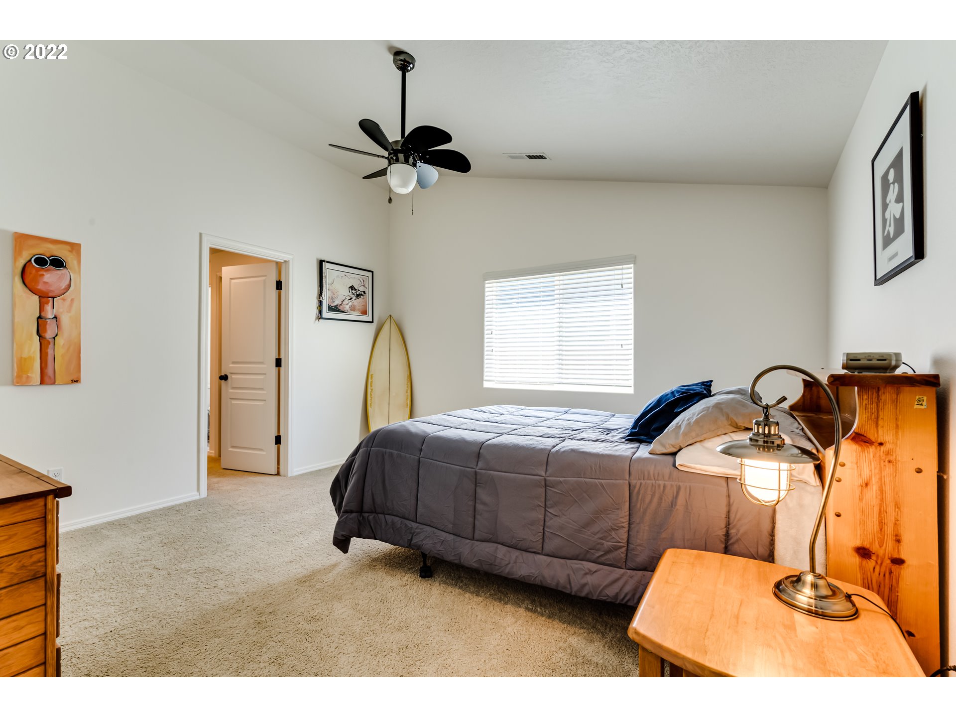 569 South 48th Street Springfield, OR 97478 - Photo 18 of 23 a bedroom with a bed and a dresser