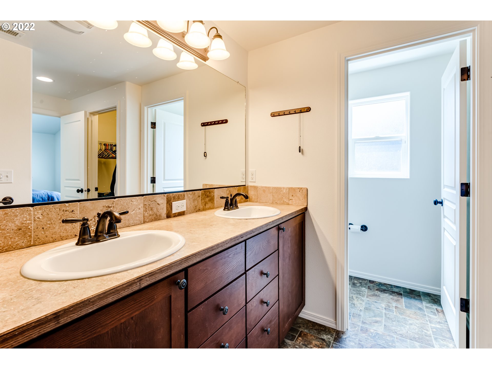 569 South 48th Street Springfield, OR 97478 - Photo 19 of 23 a bathroom with a sink and a mirror