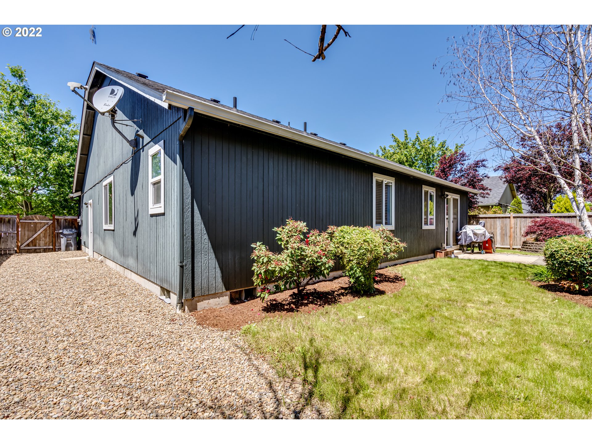 569 South 48th Street Springfield, OR 97478 - Photo 22 of 23 a backyard of a house with lots of green space