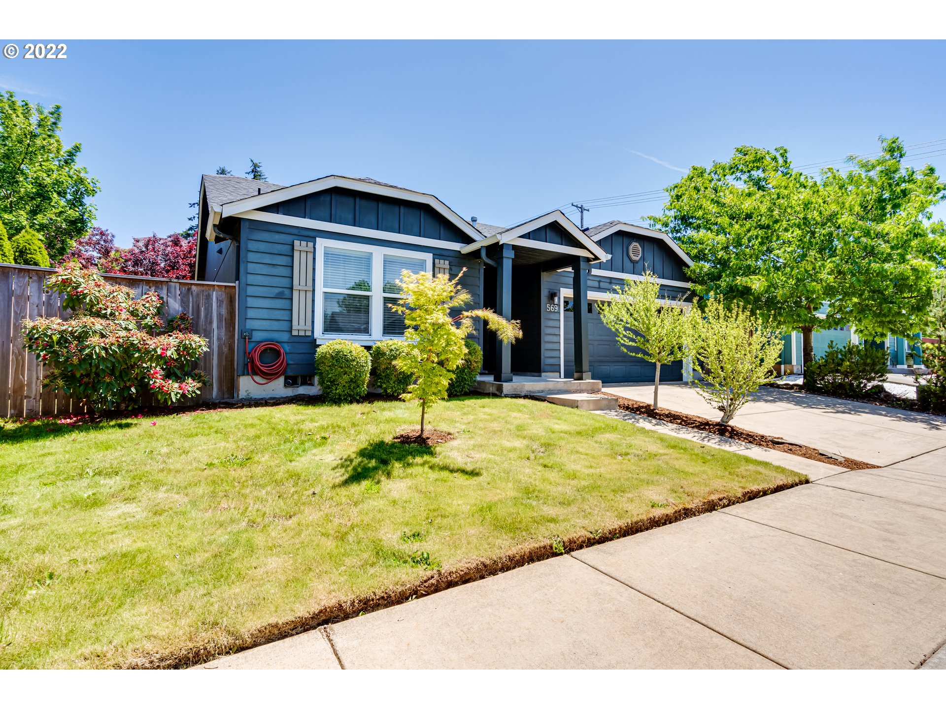 569 South 48th Street Springfield, OR 97478 - Photo 3 of 23 a front view of a house with garden