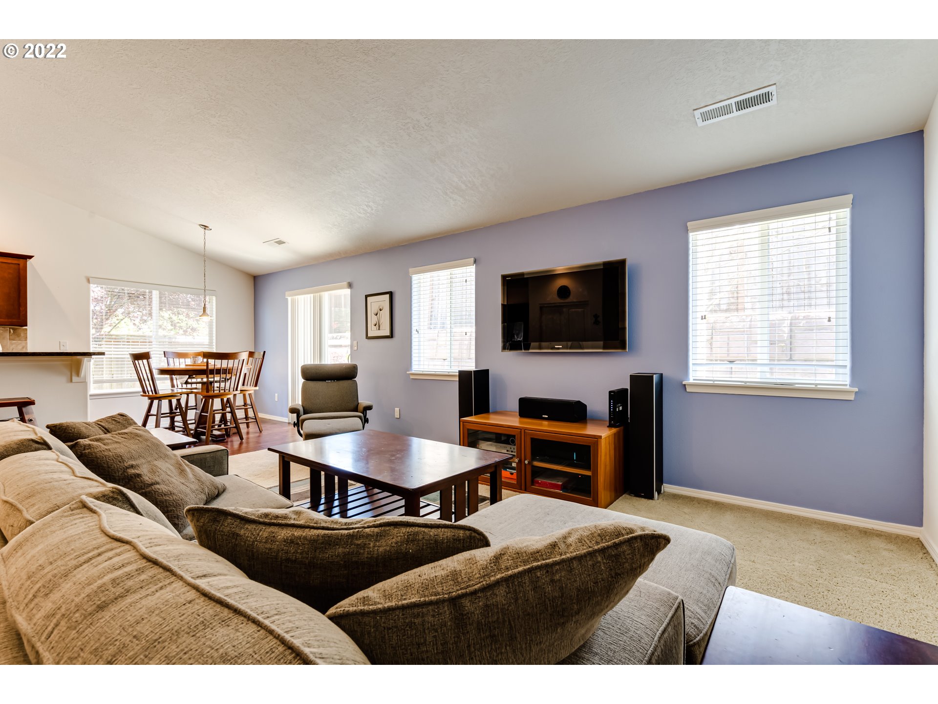 569 South 48th Street Springfield, OR 97478 - Photo 5 of 23 a living room with furniture and a flat screen tv