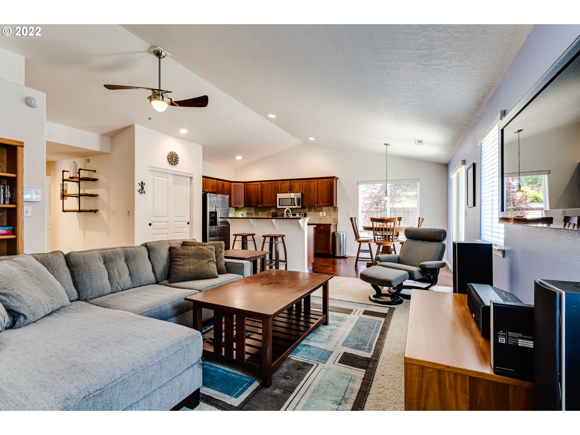 569 South 48th Street Springfield, OR 97478 - Photo 6 of 23 a living room with furniture kitchen view and a chandelier