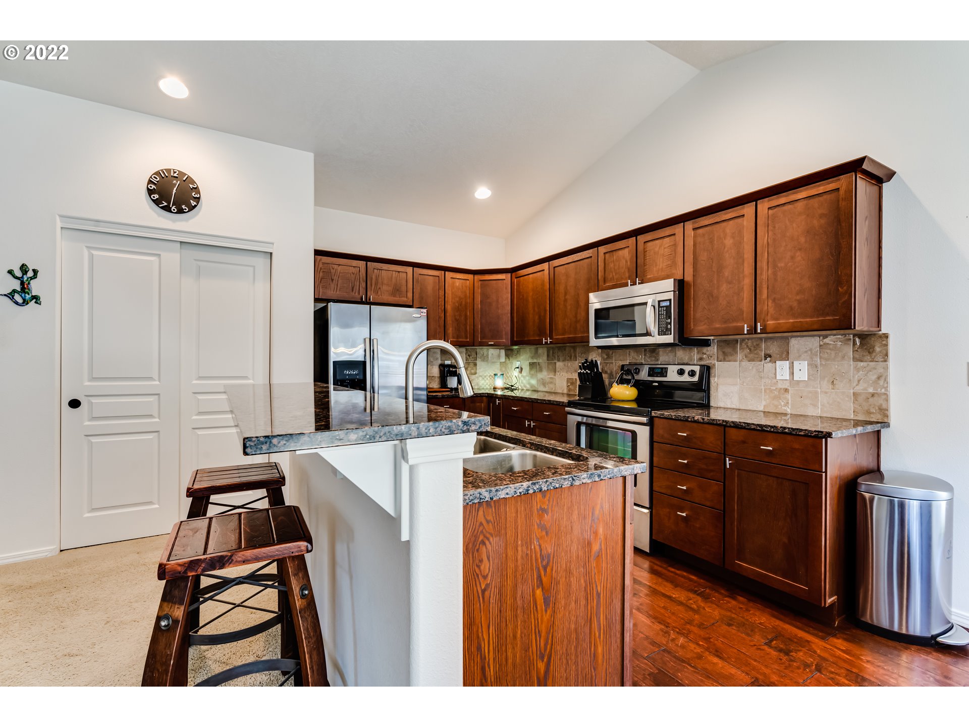 569 South 48th Street Springfield, OR 97478 - Photo 8 of 23 a kitchen with stainless steel appliances granite countertop a stove refrigerator sink and microwave