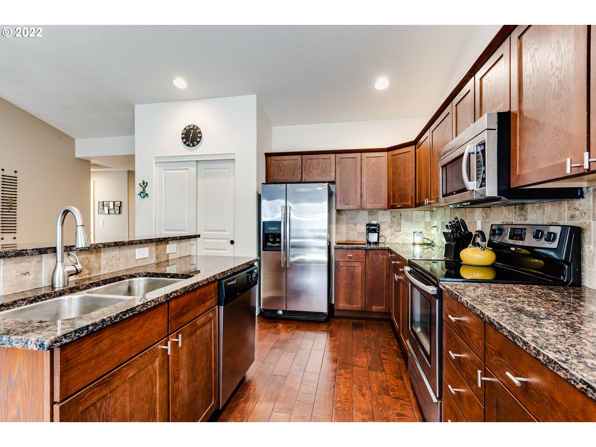 569 South 48th Street Springfield, OR 97478 - Photo 9 of 23 a kitchen with stainless steel appliances granite countertop a sink stove and refrigerator
