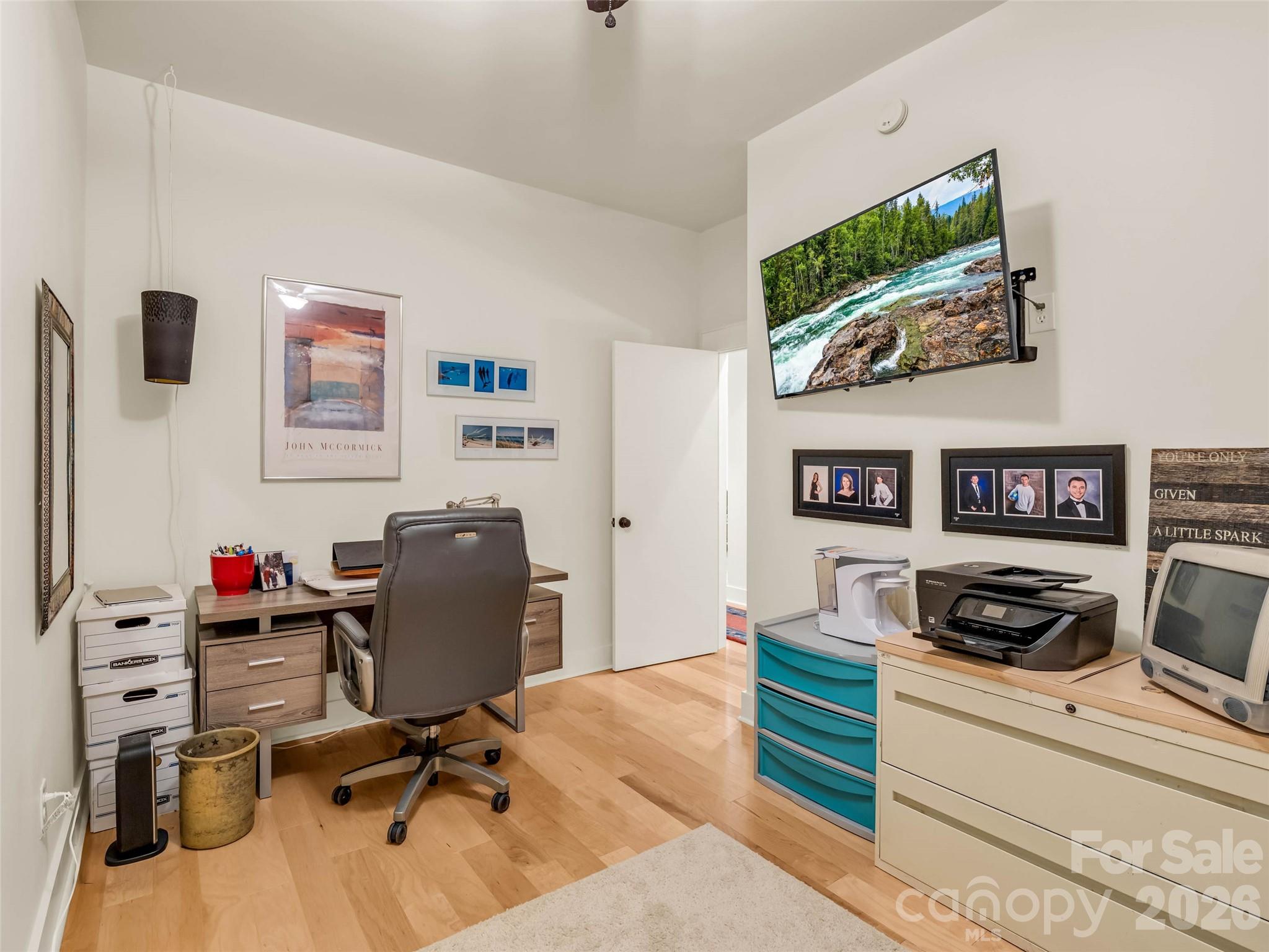 120 Glenn Court Mill Spring, NC 28756 - Photo 38 of 48 a view of a workspace with furniture and a flat screen tv