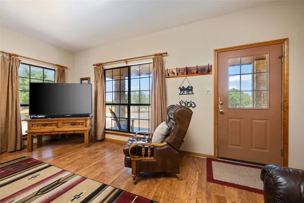 a living room with furniture fireplace and flat screen tv