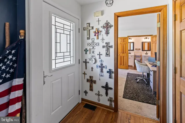 a view of a porch with furniture and front door