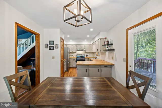 a view of kitchen with cabinets and wooden floor