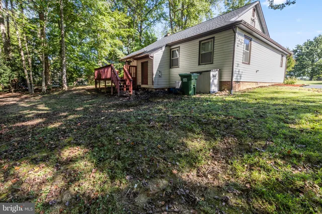 a front view of a house with a yard and porch