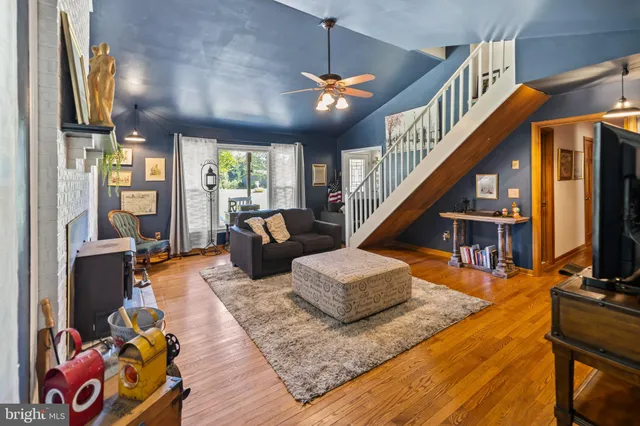 a living room with furniture fireplace and a flat screen tv