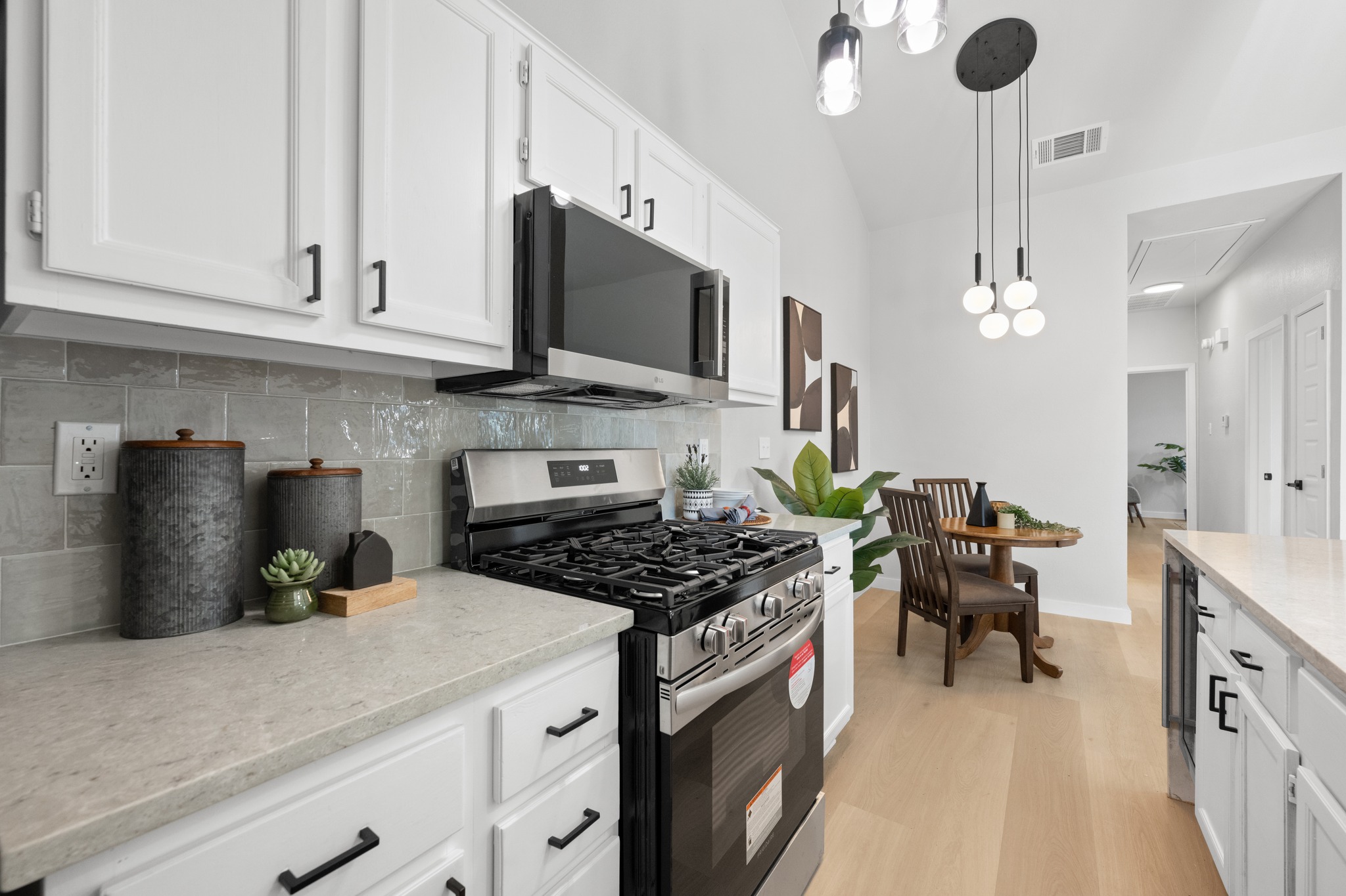 6501 Brush Country Road, Unit 120 Austin, TX 78749 - Photo 10 of 26 Modernized kitchen designed to impress, featuring a brand-new 1.8 cu. ft. LG over-the-range microwave and a Frigidaire stainless steel gas range