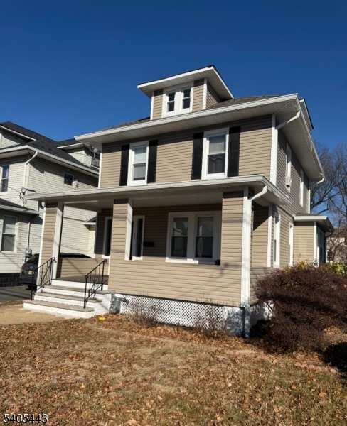 75 Hillside Avenue Hillside, NJ 07205 - Photo 2 of 10 a front view of a house with a yard