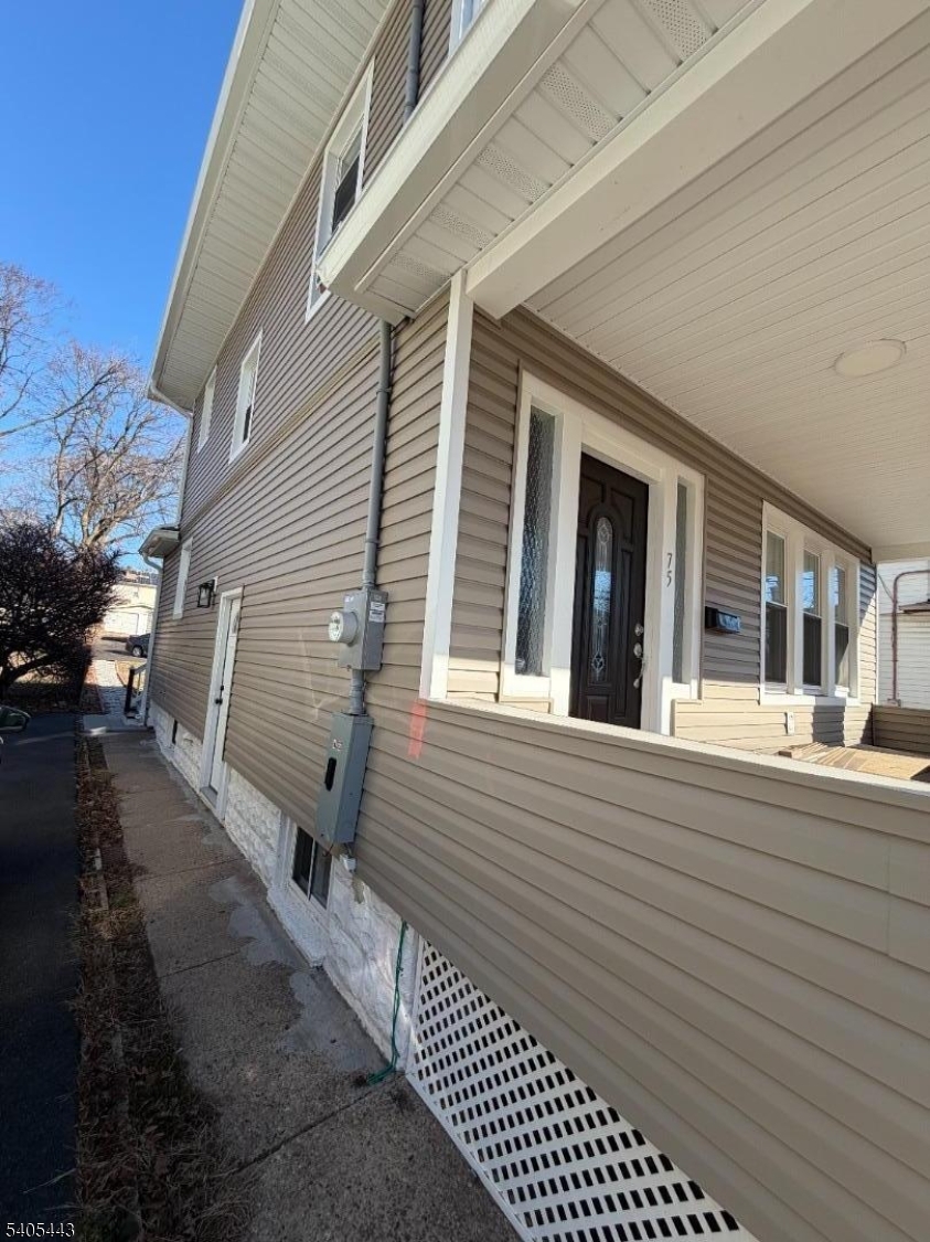 75 Hillside Avenue Hillside, NJ 07205 - Photo 3 of 10 a view of a house with a patio