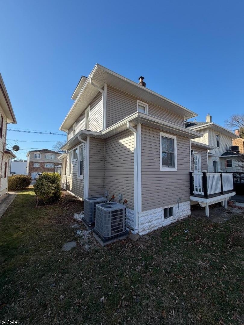 75 Hillside Avenue Hillside, NJ 07205 - Photo 4 of 10 a view of a house with backyard and sitting area