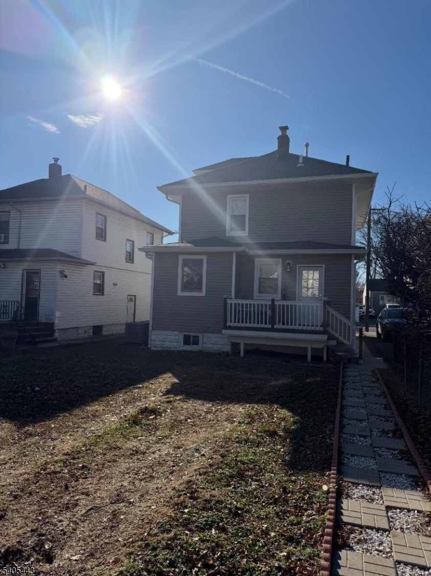 75 Hillside Avenue Hillside, NJ 07205 - Photo 6 of 10 a front view of a house with a yard