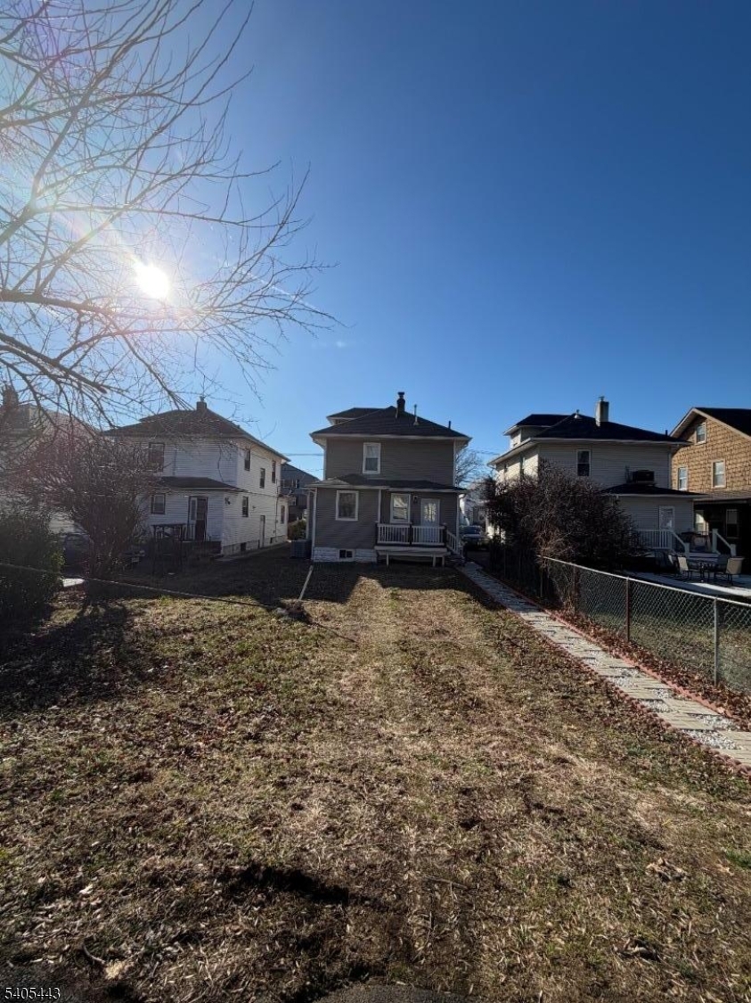 75 Hillside Avenue Hillside, NJ 07205 - Photo 7 of 10 a car parked in front of a house