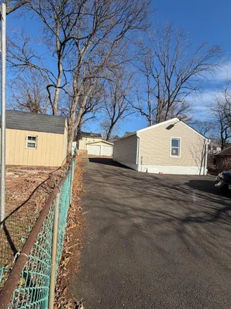 a view of a street with a tree