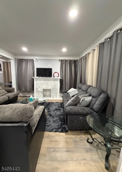 75 Hillside Avenue Hillside, NJ 07205 - Photo 9 of 10 a living room with furniture and a flat screen tv
