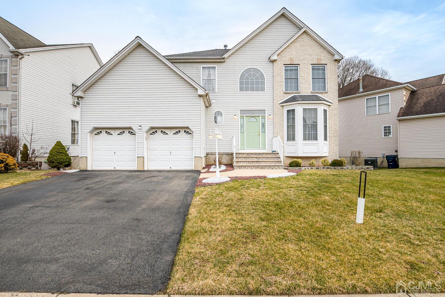 22 Timber Ridge Road North Brunswick, NJ 08902 - Photo 1 of 50 a view of a white house with large windows