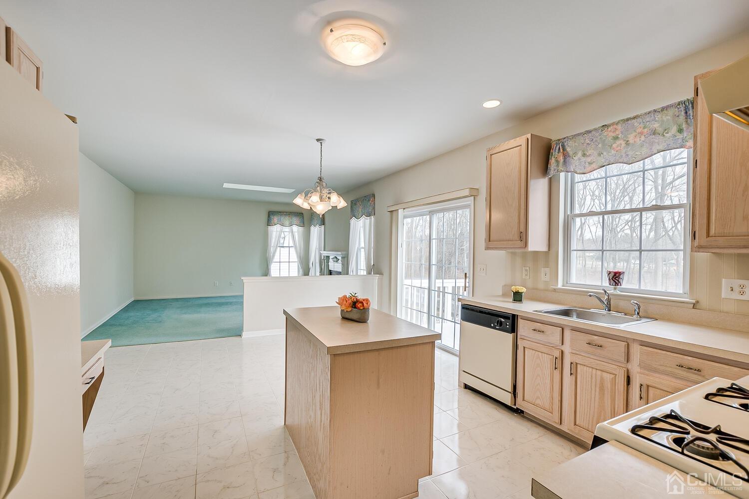 22 Timber Ridge Road North Brunswick, NJ 08902 - Photo 11 of 50 a large kitchen with a sink stove and refrigerator
