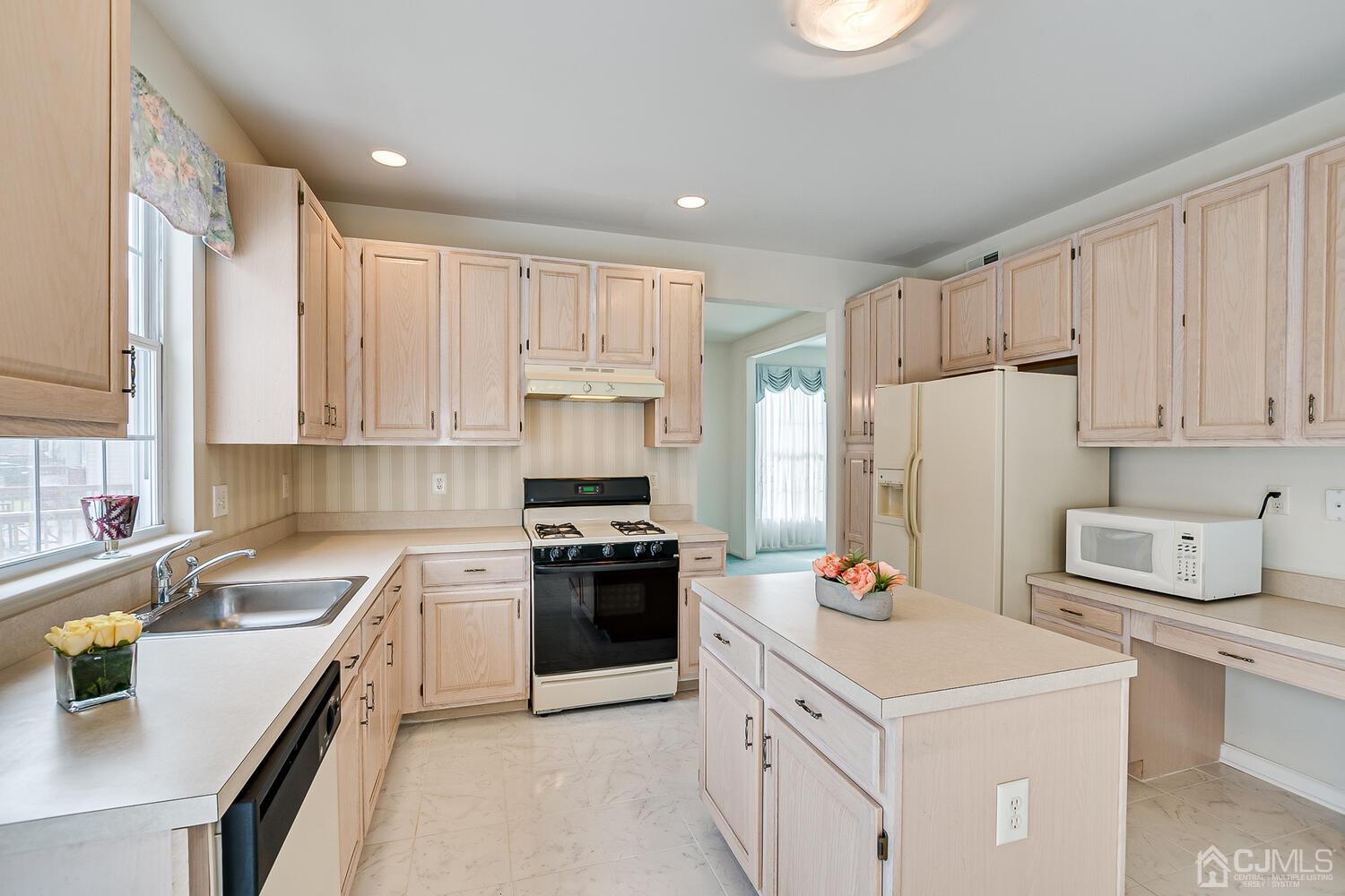 22 Timber Ridge Road North Brunswick, NJ 08902 - Photo 15 of 50 a kitchen with a sink stove and refrigerator