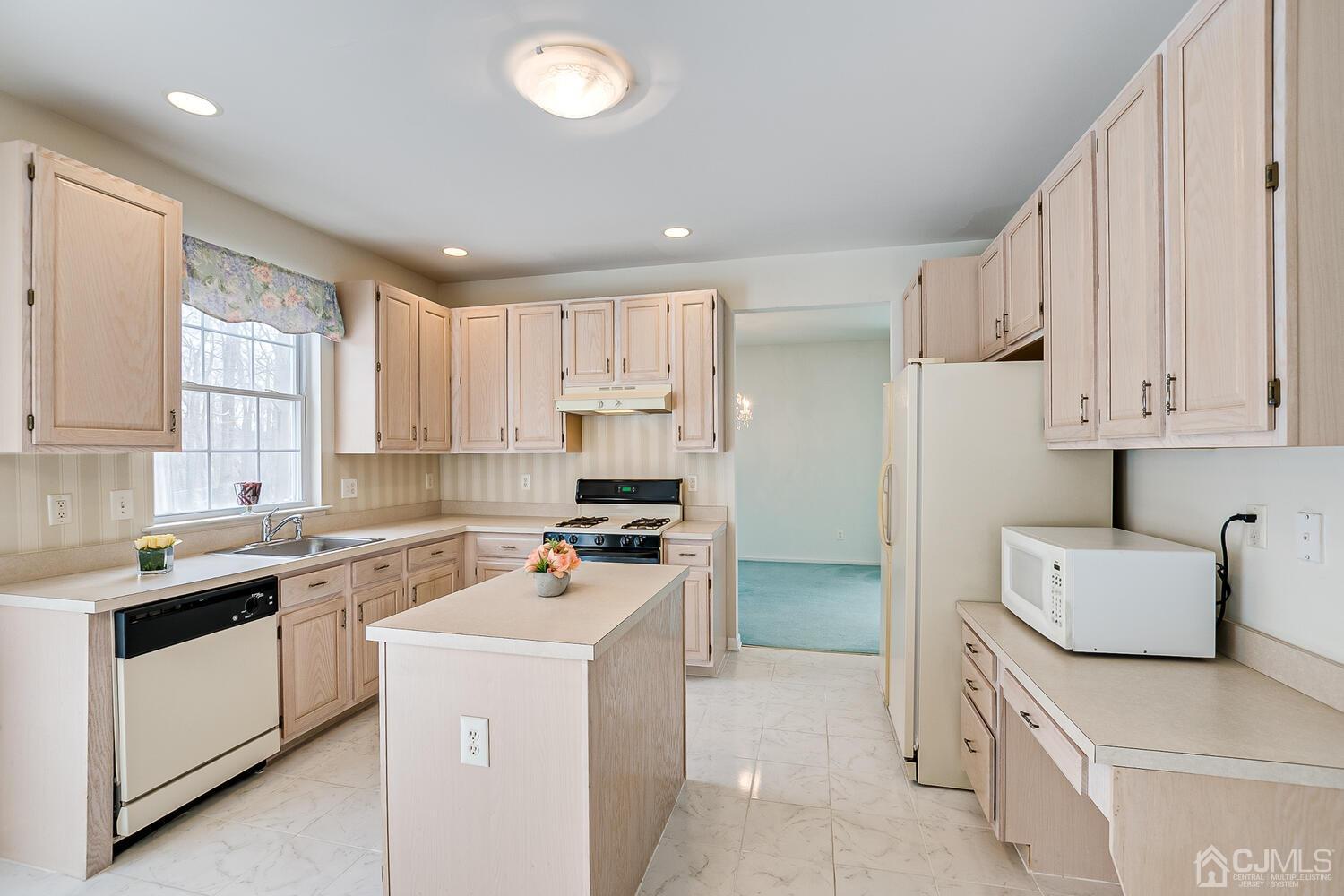 22 Timber Ridge Road North Brunswick, NJ 08902 - Photo 16 of 50 a kitchen with cabinets and appliances