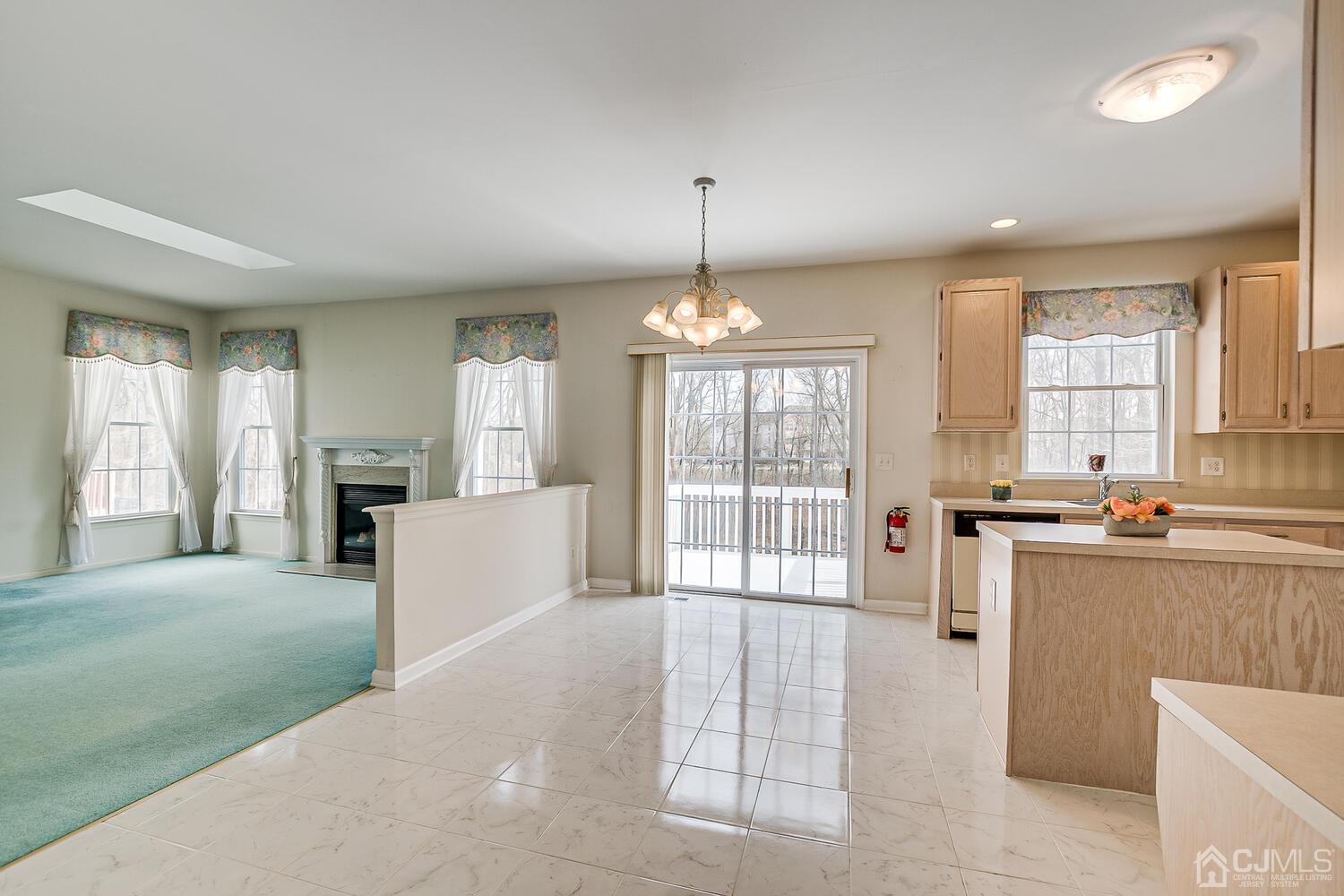22 Timber Ridge Road North Brunswick, NJ 08902 - Photo 20 of 50 a large white kitchen with granite countertop a large window