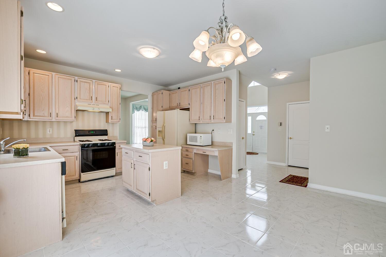22 Timber Ridge Road North Brunswick, NJ 08902 - Photo 21 of 50 a kitchen with a sink stainless steel appliances and cabinets