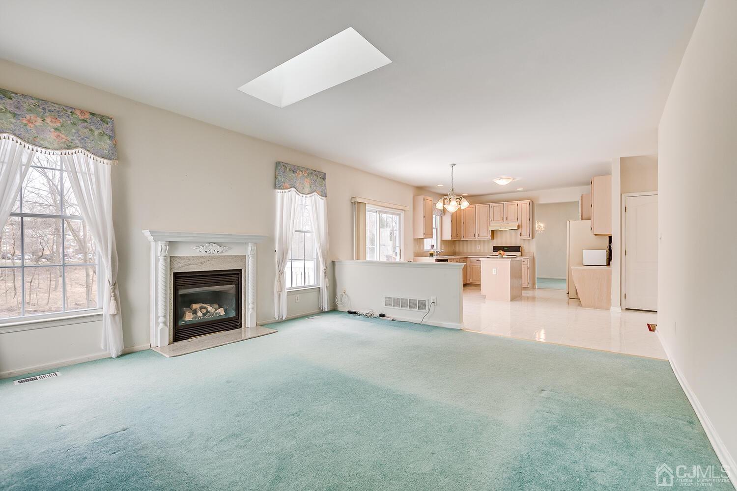 22 Timber Ridge Road North Brunswick, NJ 08902 - Photo 23 of 50 a view of a livingroom with a fireplace cabinet and a window