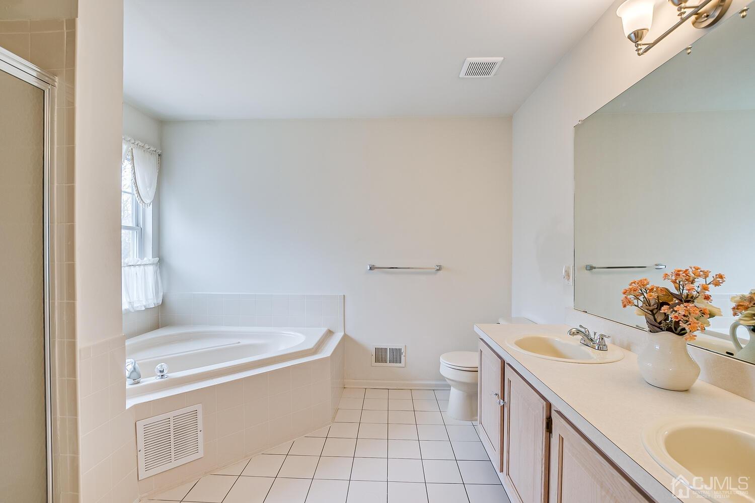 22 Timber Ridge Road North Brunswick, NJ 08902 - Photo 31 of 50 a bathroom with a sink toilet vanity and tub