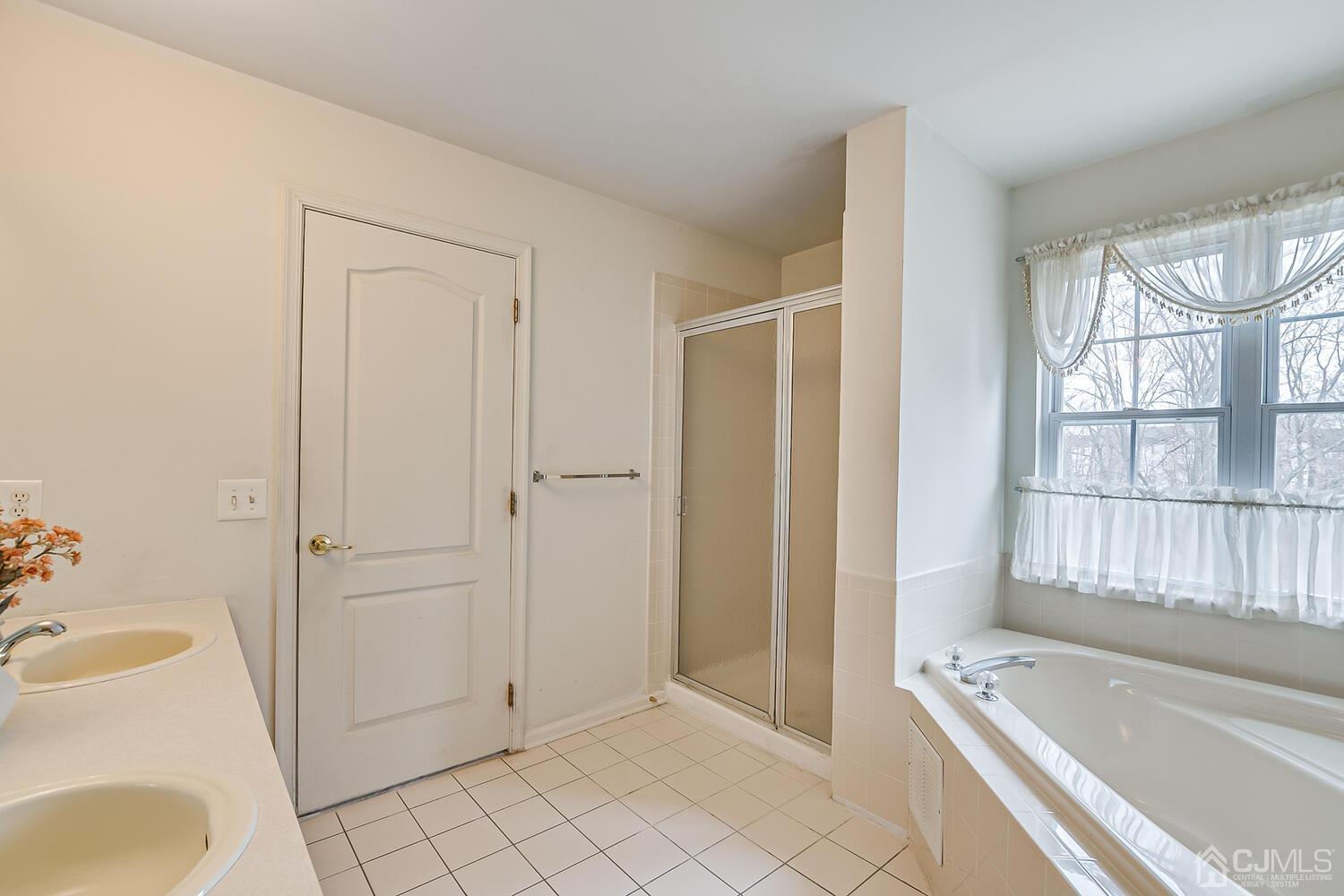 22 Timber Ridge Road North Brunswick, NJ 08902 - Photo 32 of 50 a bathroom with a tub shower and sink