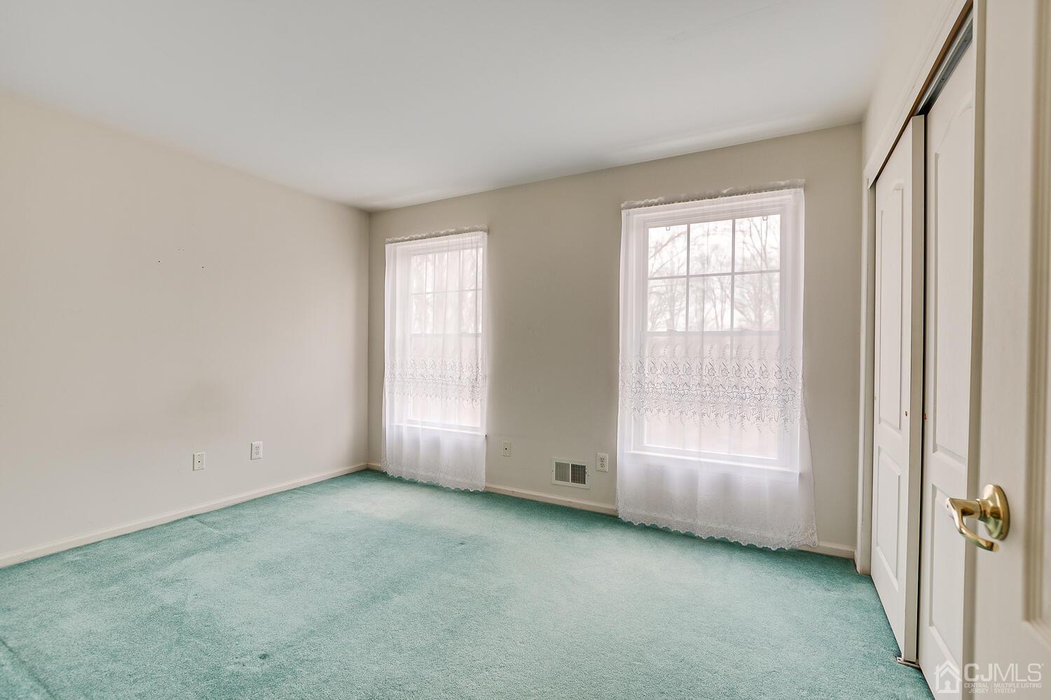 22 Timber Ridge Road North Brunswick, NJ 08902 - Photo 35 of 50 an empty room with windows and closet