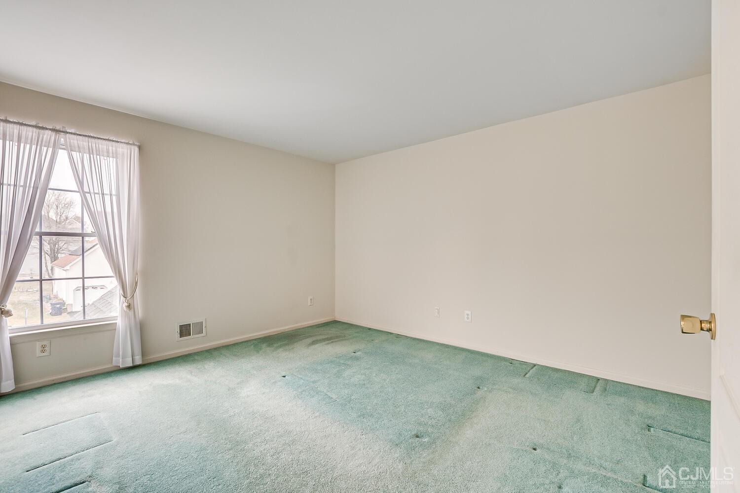 22 Timber Ridge Road North Brunswick, NJ 08902 - Photo 38 of 50 an empty room with a window