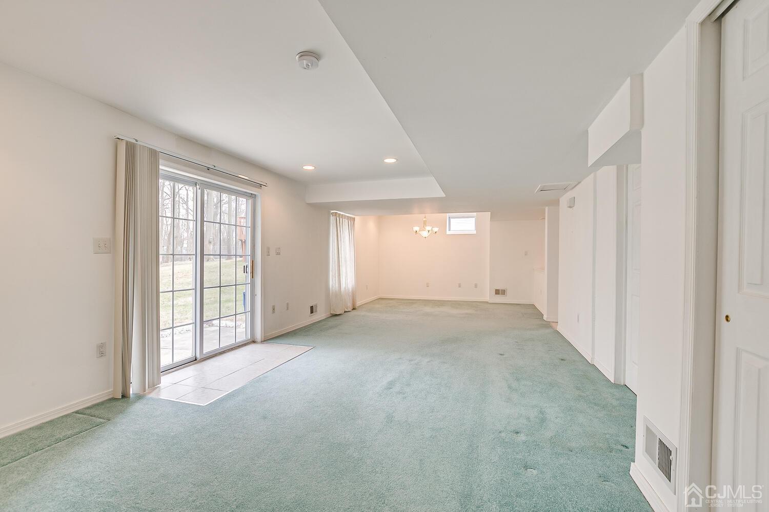 22 Timber Ridge Road North Brunswick, NJ 08902 - Photo 43 of 50 a view of an empty room with a window