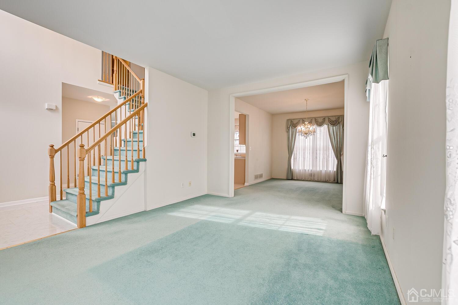 22 Timber Ridge Road North Brunswick, NJ 08902 - Photo 7 of 50 a view of an empty room with stairs