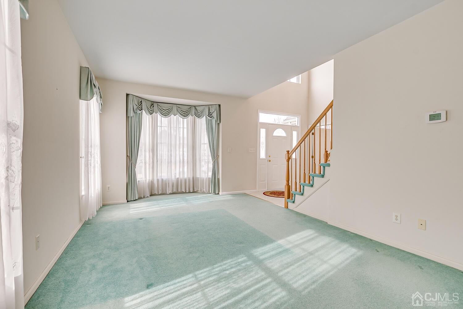 22 Timber Ridge Road North Brunswick, NJ 08902 - Photo 8 of 50 a view of a hallway with windows